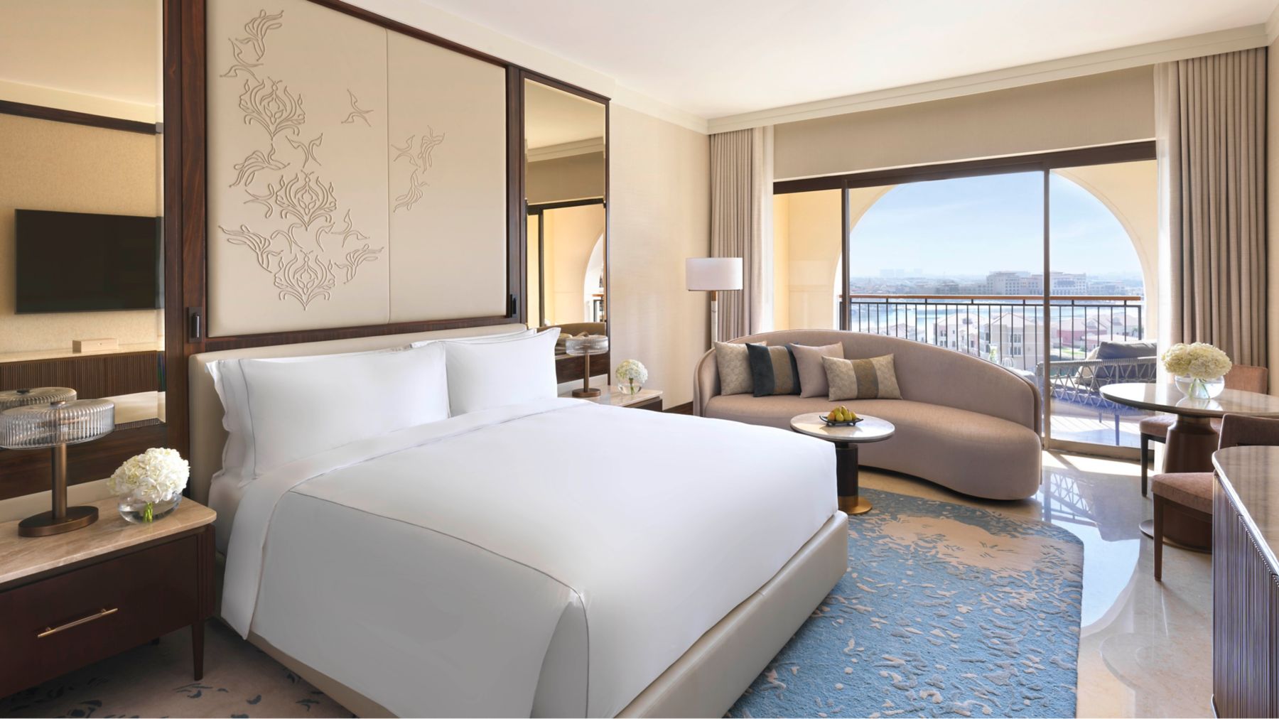A guest room at The Ritz-Carlton Abu Dhabi with a private balcony