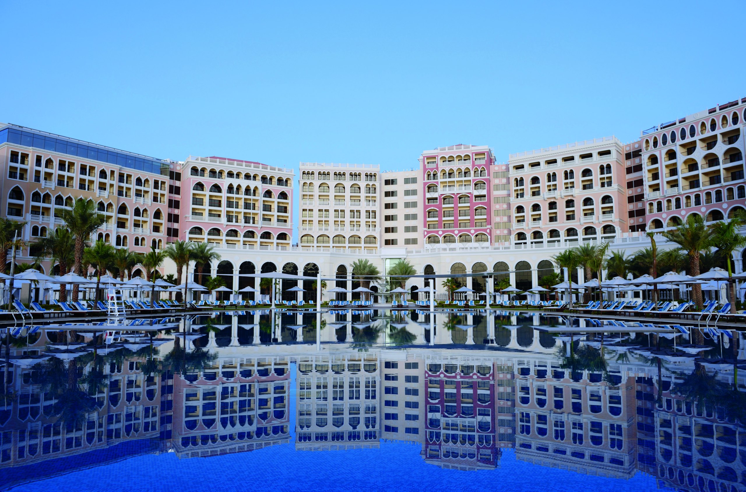 The Ritz-Carlton Abu Dhabi reflected in its pool
